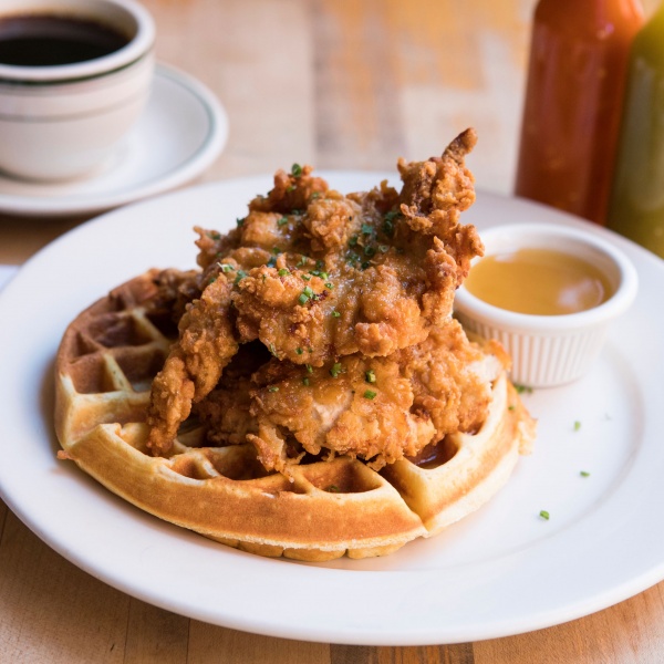Buttermilk Fried Chicken and Waffles with maple butter, hot sauce, and black coffee